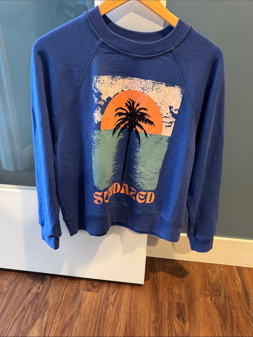 Blue 'Sundazed' Liberate Cropped Palm-Graphic Crewneck Sweatshirt - Picture 1 of 3
